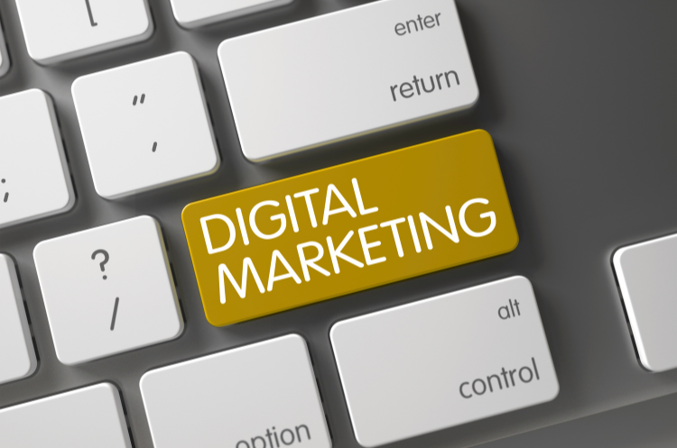 Close-up of a computer keyboard featuring a prominent yellow key with the words "DIGITAL MARKETING," highlighting the focus on online strategy.