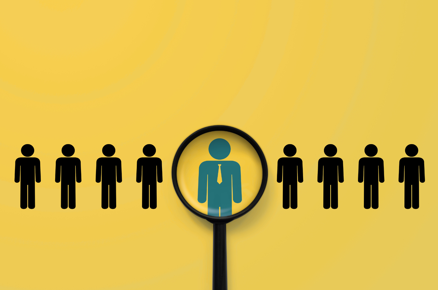 Magnifying glass highlighting a standout professional figure among a row of people icons, symbolizing HR leadership, talent selection, and CHRO role.