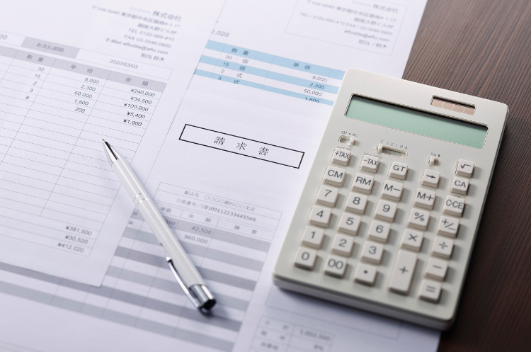 financial documents with calculator and pen on desk,accurate budgeting, tax calculation, and expense tracking for senior finance analysts