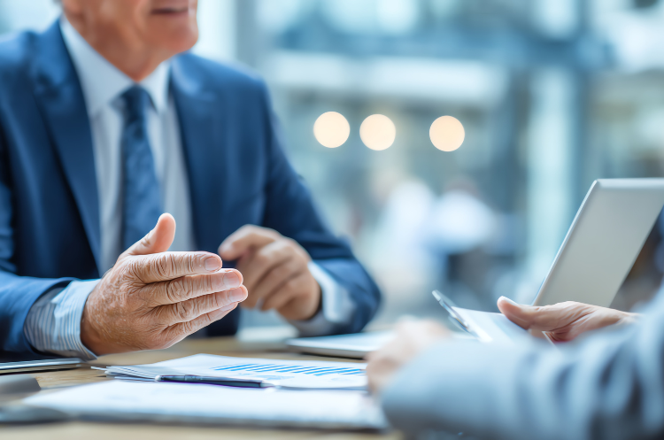 An experienced Director of Operations in a suit discusses strategy in a business meeting, referencing a complete guide to excelling in the role.