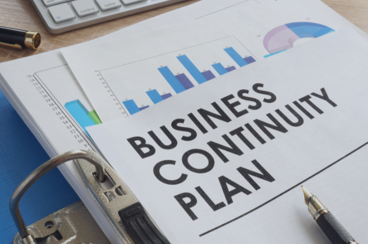 Business continuity planning document with financial charts and reports for risk management and disaster recovery.