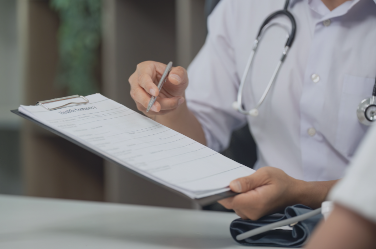 Healthcare consultant reviewing patient records and medical documents, representing healthcare consulting, hospital operations, and strategic advisory in India.