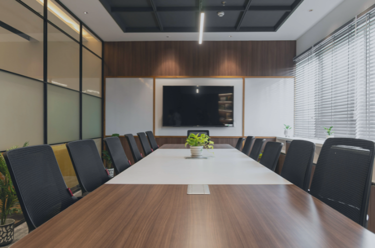 Modern boardroom with a conference table, representing interim executive management, leadership transitions, and business strategy in India.
