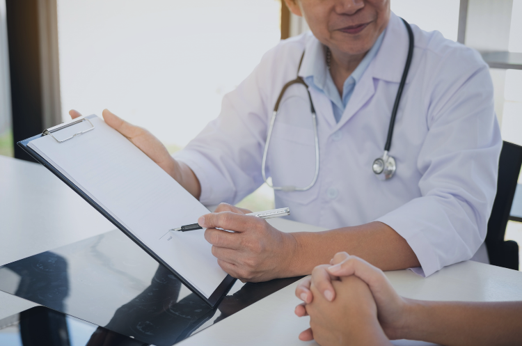 Healthcare consultant discussing medical documentation with a patient during a consultation.