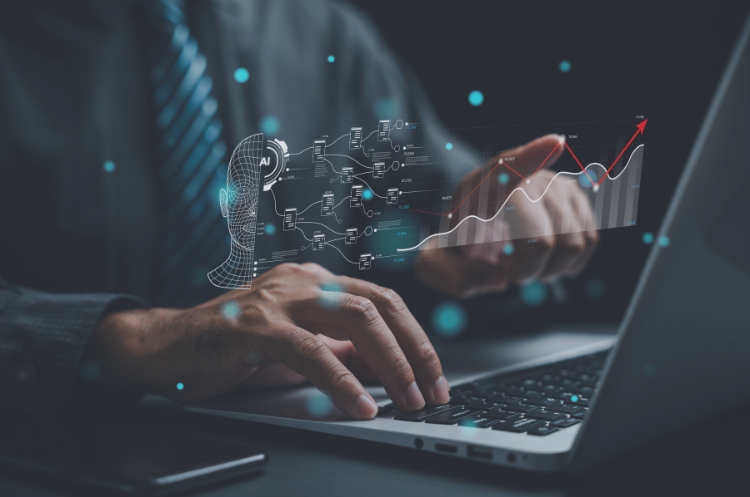 Professional using a laptop with AI technology, digital data visualizations, and rising analytics graphs displayed on screen.
