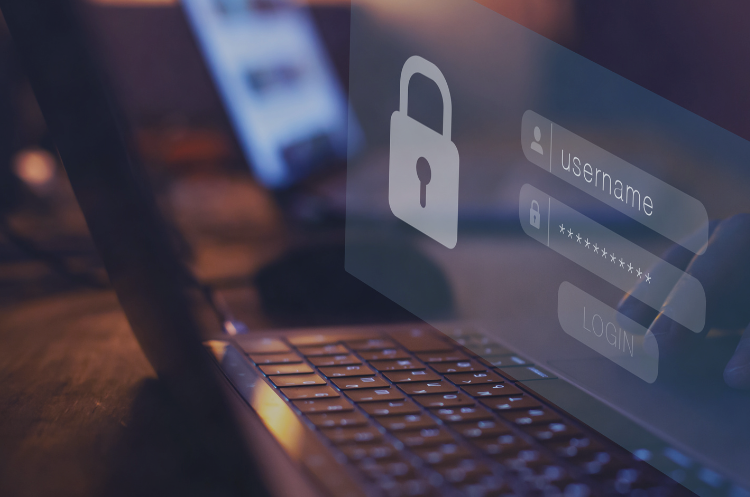 Laptop displaying a cybersecurity login screen with a padlock and username and password fields.